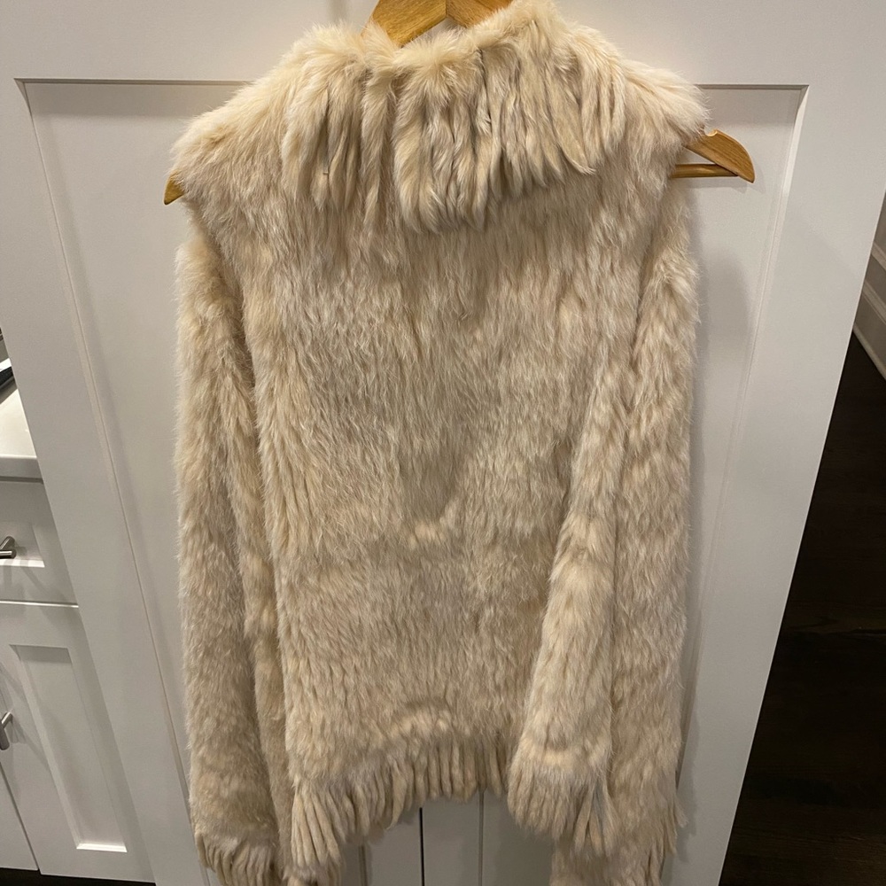 Rabbit fur vest. Nothing wrong with it just not using it.